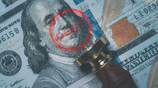 debt stamped on dollar